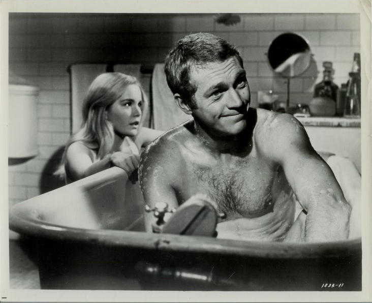 Tuesday Weld and Steve McQueen.  
Steve sitting in bath tub.